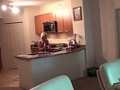 Sexy babe in red apron cooking